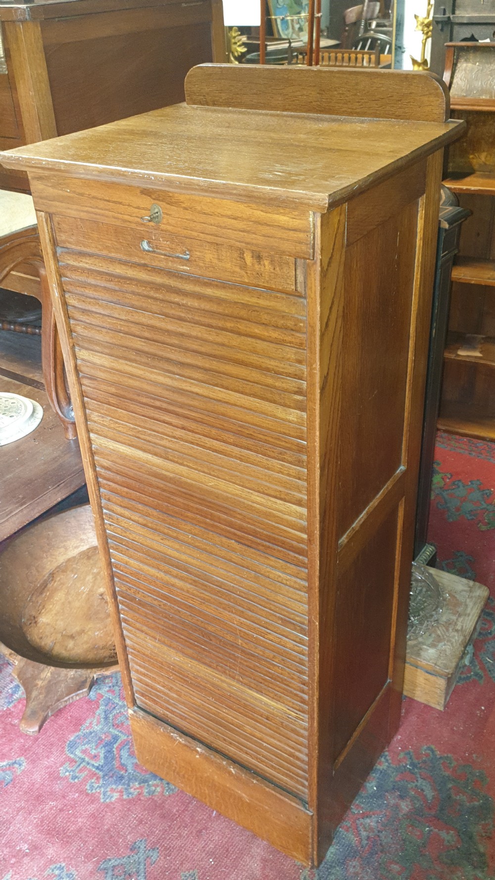 Early 20th century oak tambour front office cabinet. 