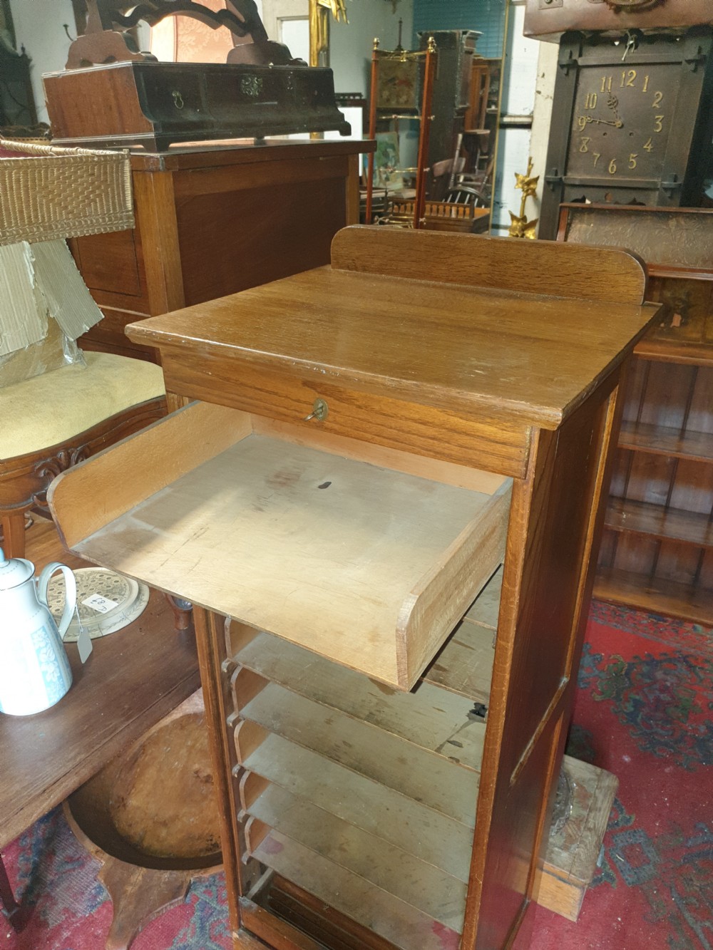Early 20th century oak tambour front office cabinet.  View IV
