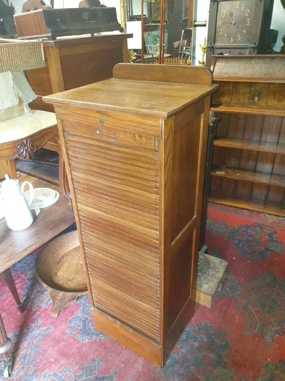Early 20th century oak tambour front office cabinet.  View V
