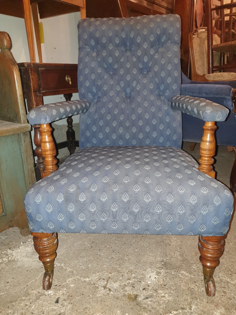 Victorian upholstered armchair with good legs and castors.  View IV