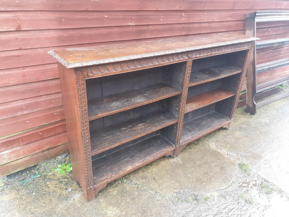 Useful late Victorian carved oak bookcase  View III
