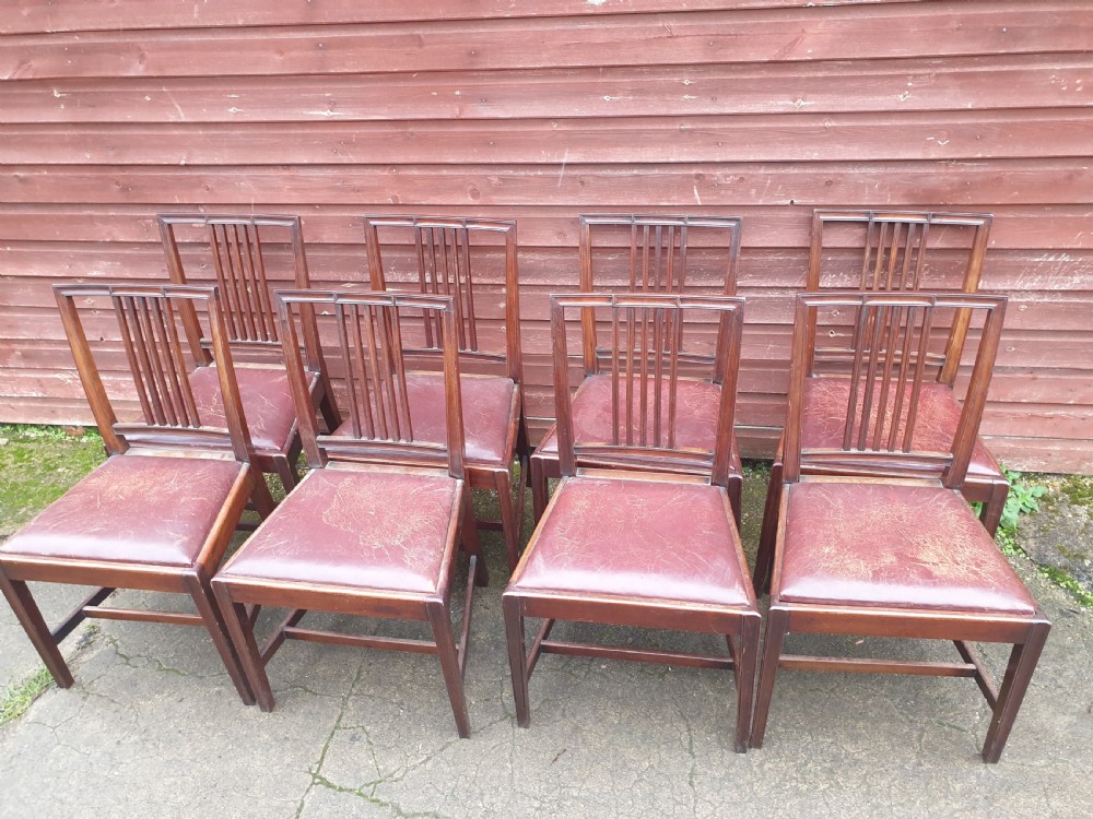 Set of 8 mahogany dining chairs with leather seats. View II