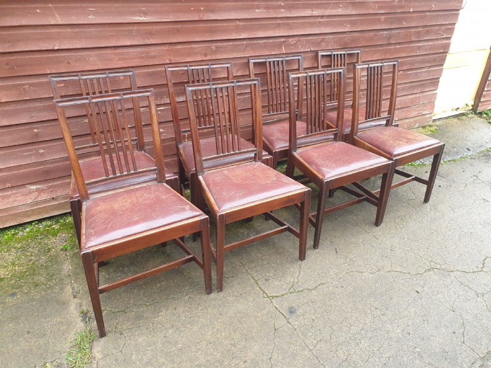 Set of 8 mahogany dining chairs with leather seats. View VI