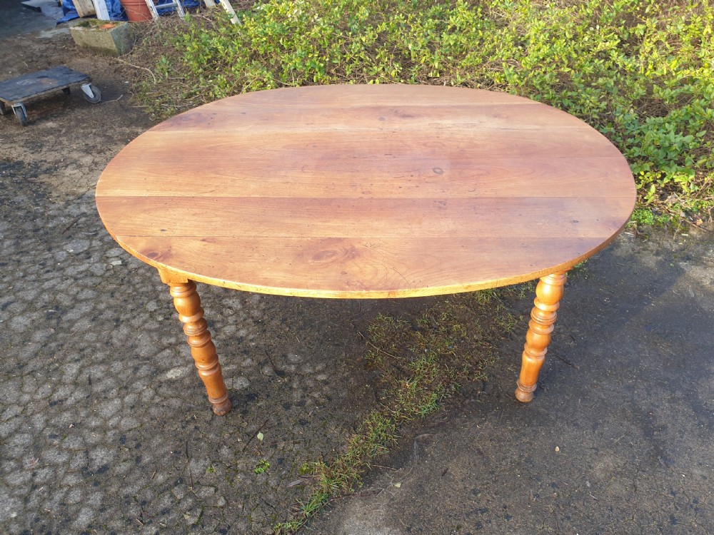 Late 19th century fruitwood oval kitchen dining table. 