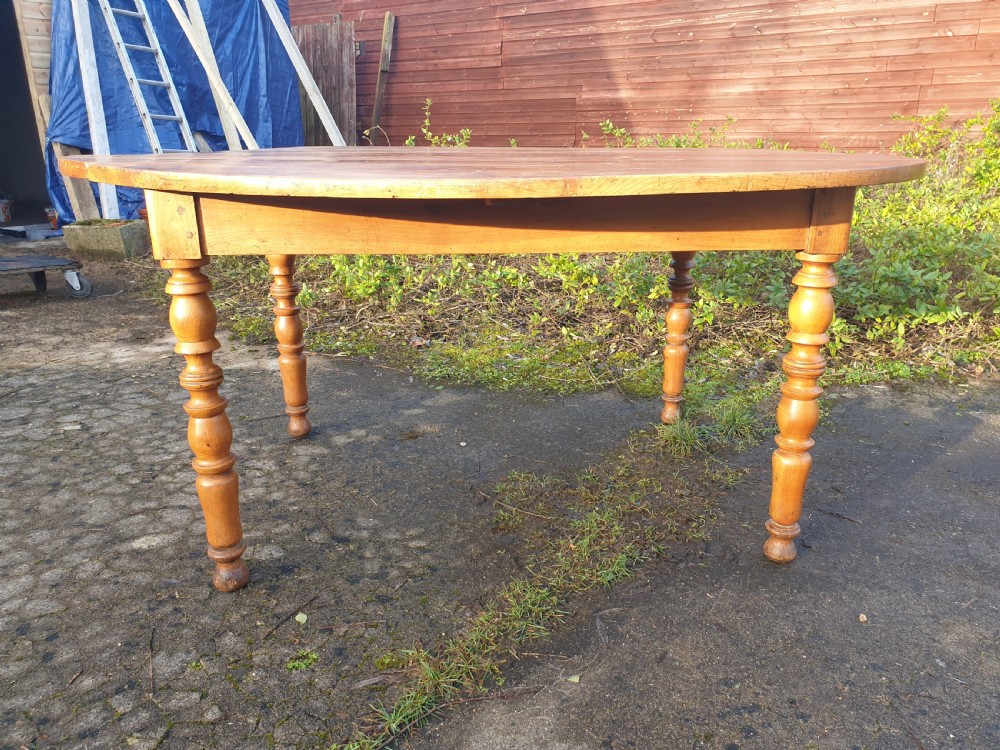 Late 19th century fruitwood oval kitchen dining table.  View II