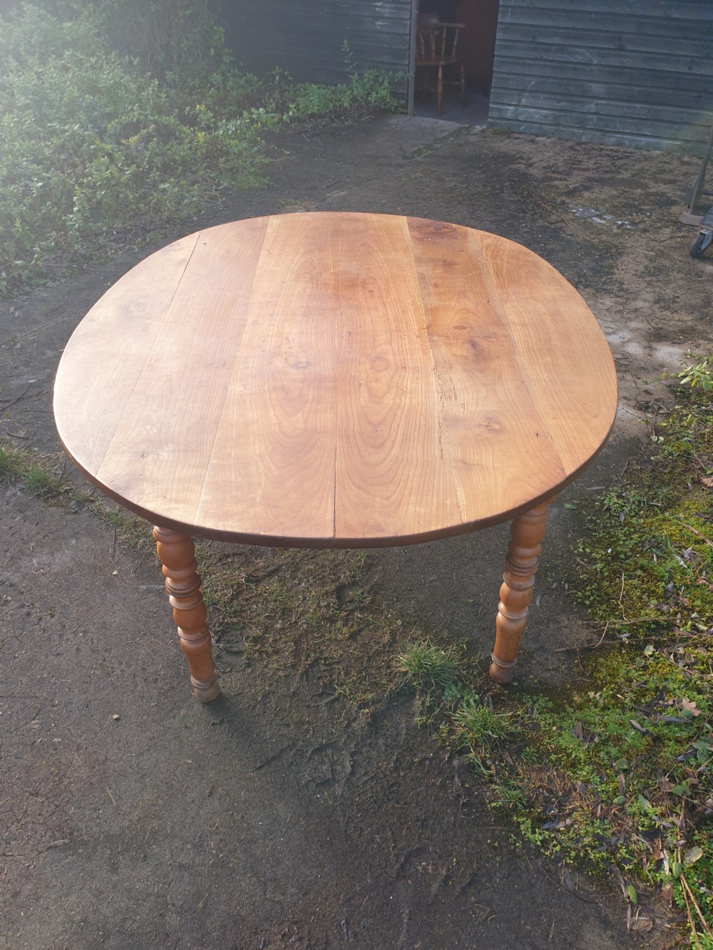 Late 19th century fruitwood oval kitchen dining table.  View III
