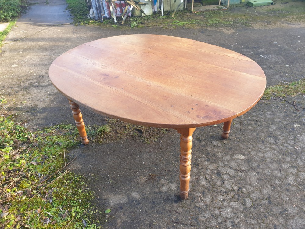 Late 19th century fruitwood oval kitchen dining table.  View IV