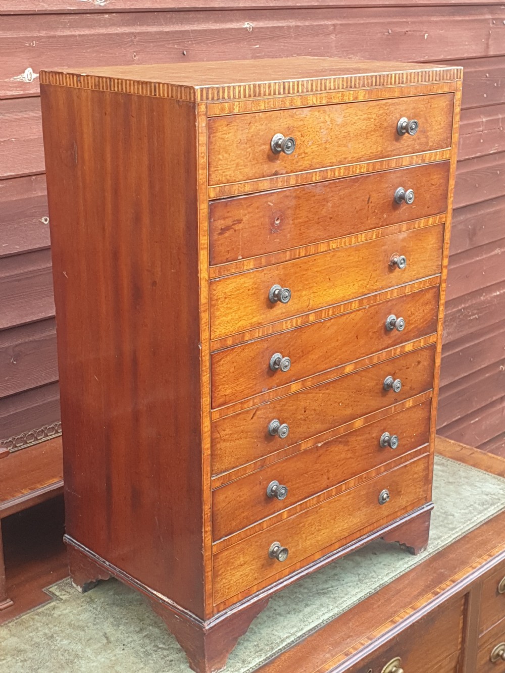 Small inlaid mahogany collectors chest.