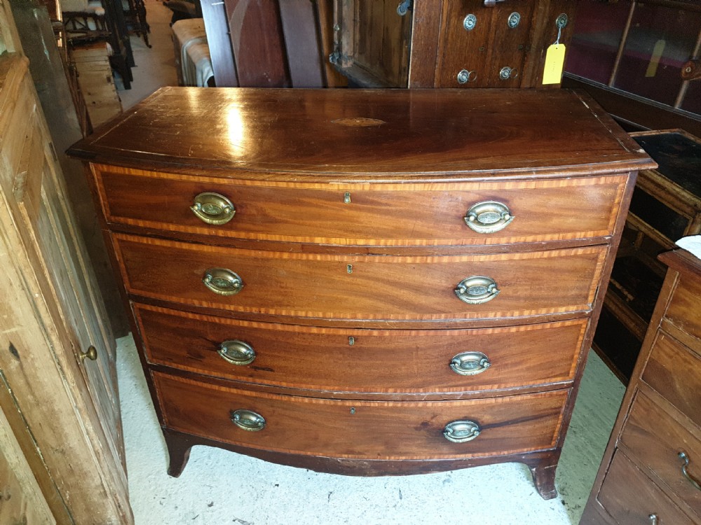 19th century inlaid bow front chest.