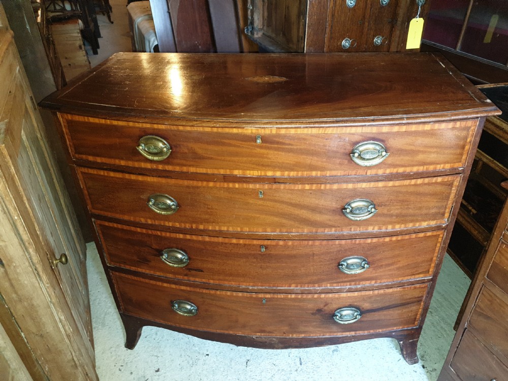 19th century inlaid bow front chest. View II