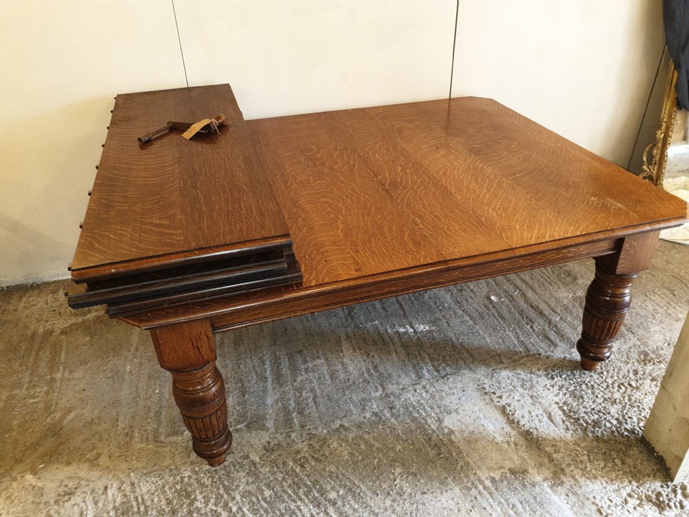 Large Victorian oak extending dining table.  View III