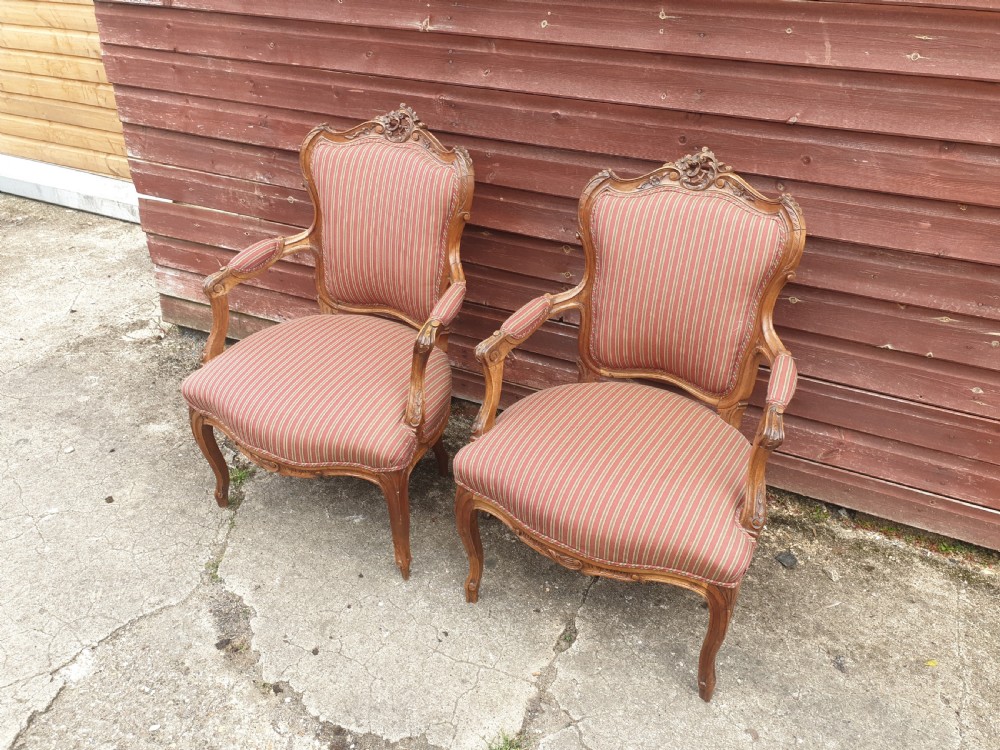 Pair of French carved walnut fauteuil 