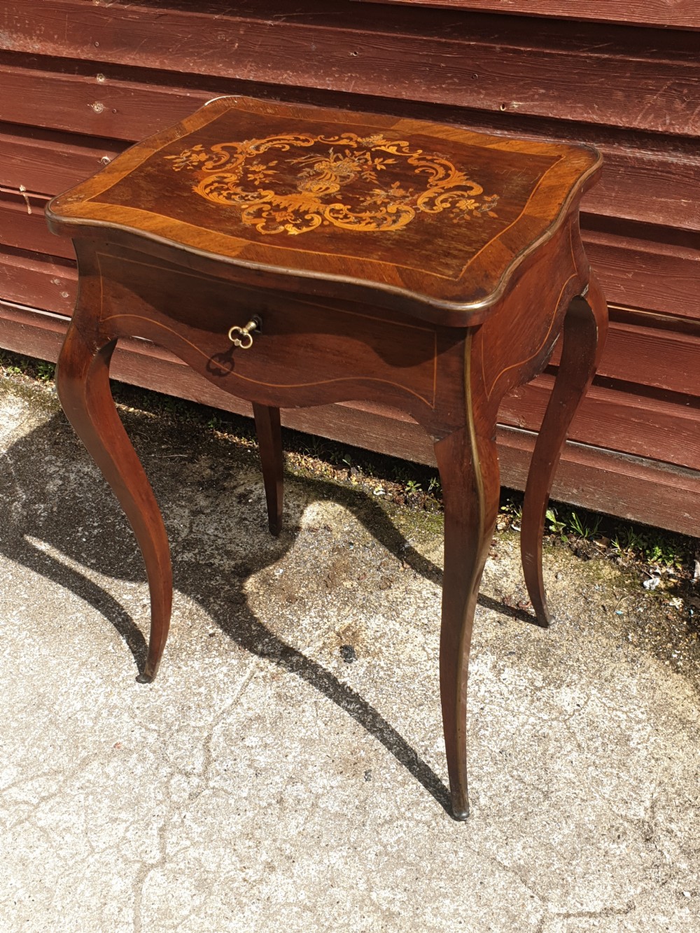 Late 19th century inlaid rosewood side table with lift up lid.