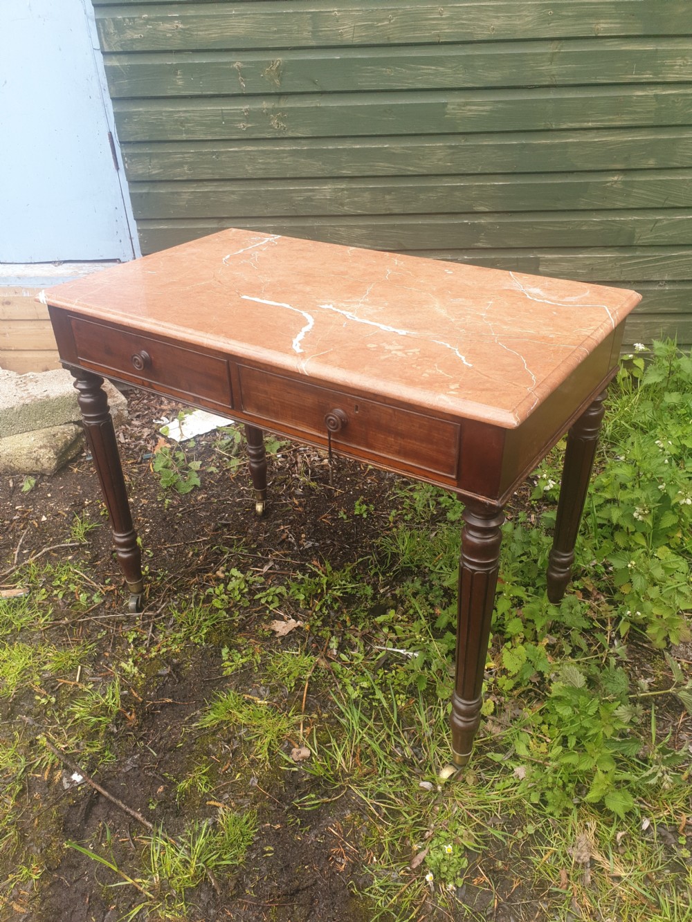 Early Victorian mahogany marble top table.  View II