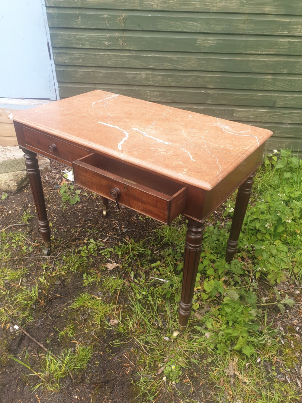 Early Victorian mahogany marble top table.  View III