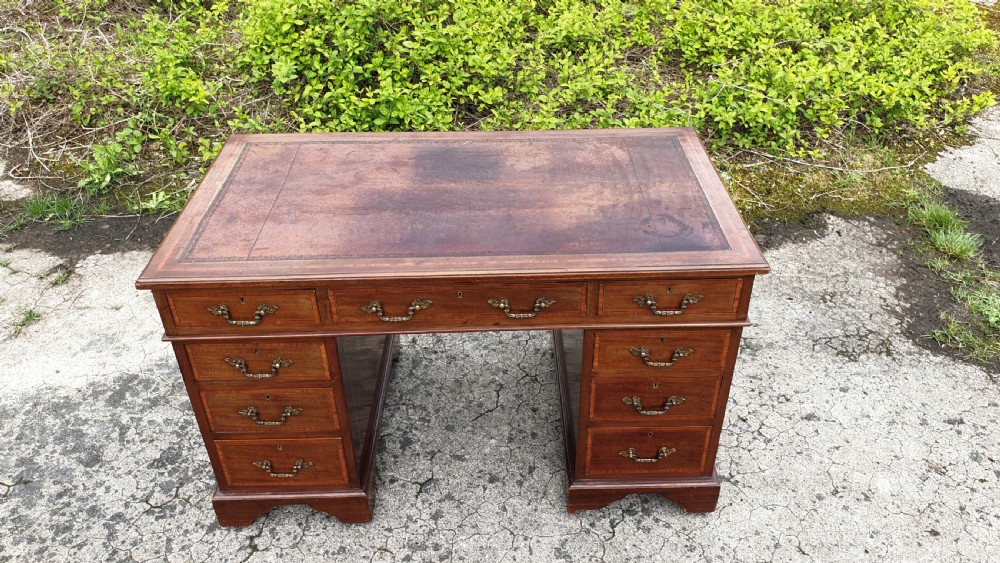 Edwardian inlaid mahogany pedestal desk. 