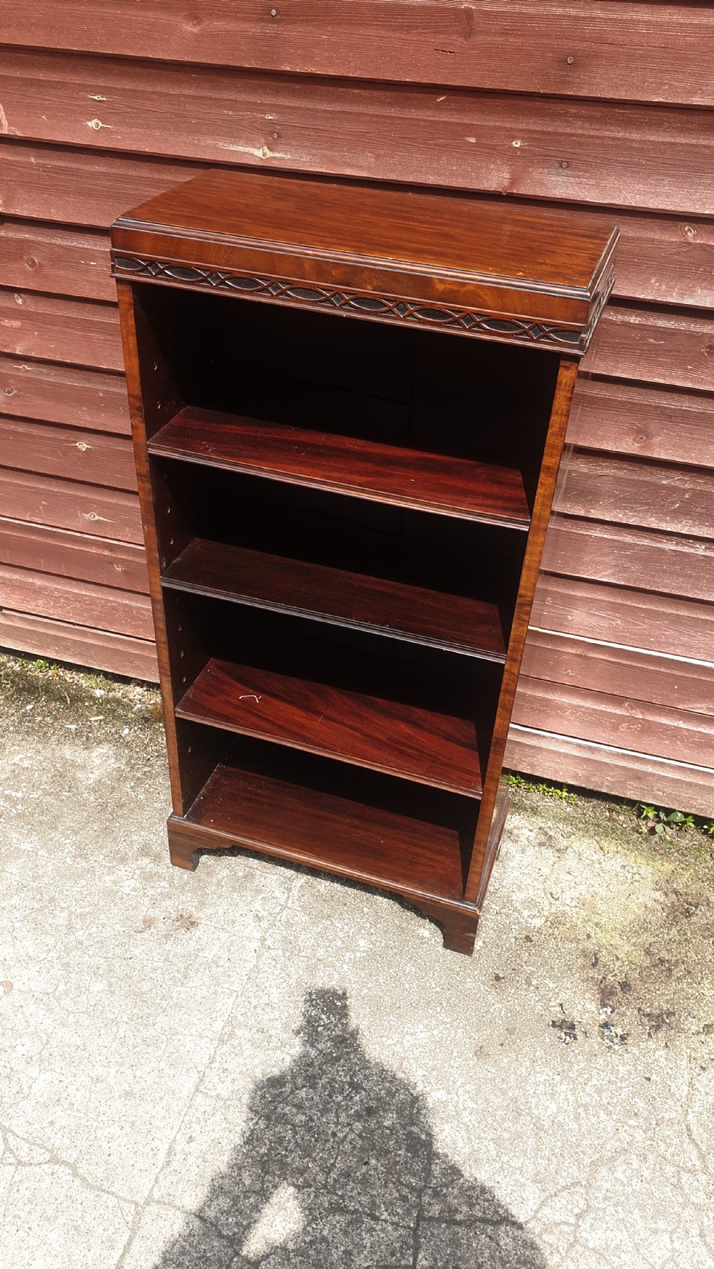 Small mahogany open front bookcase 
