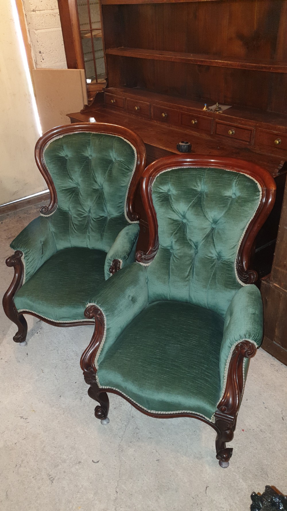 Close pair of Mahogany frame Spoon back upholstered armchairs.  View II
