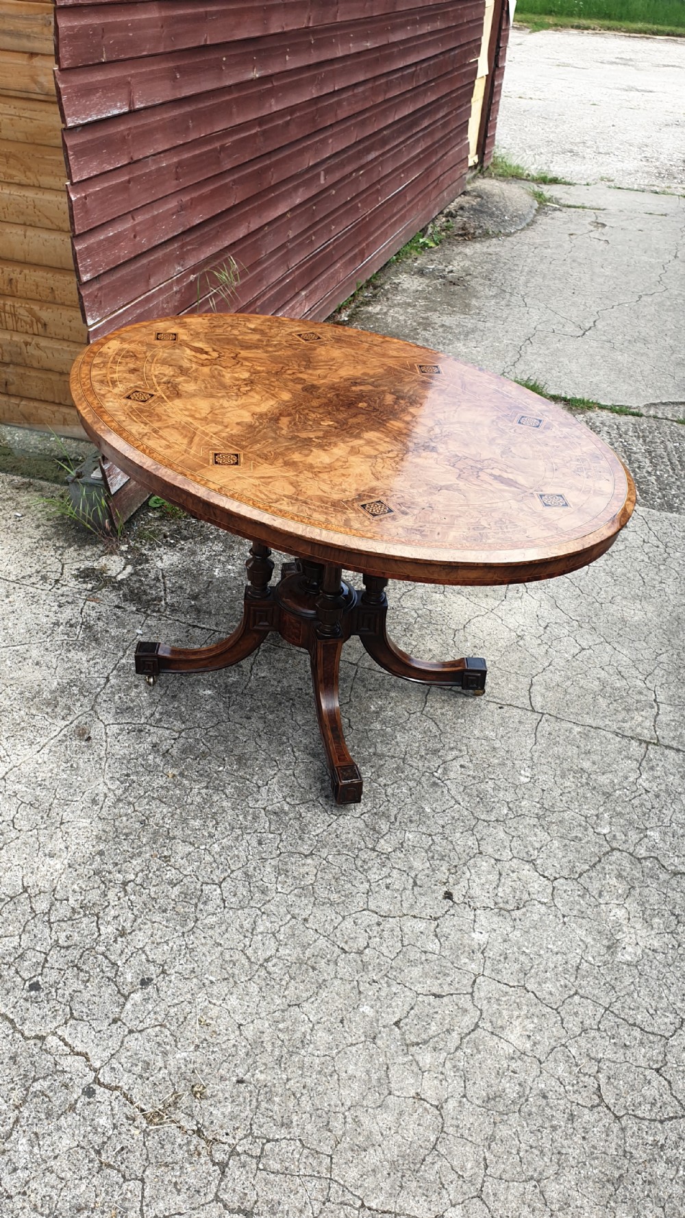 Victorian inlaid walnut oval tip top pedestal table.  View VI