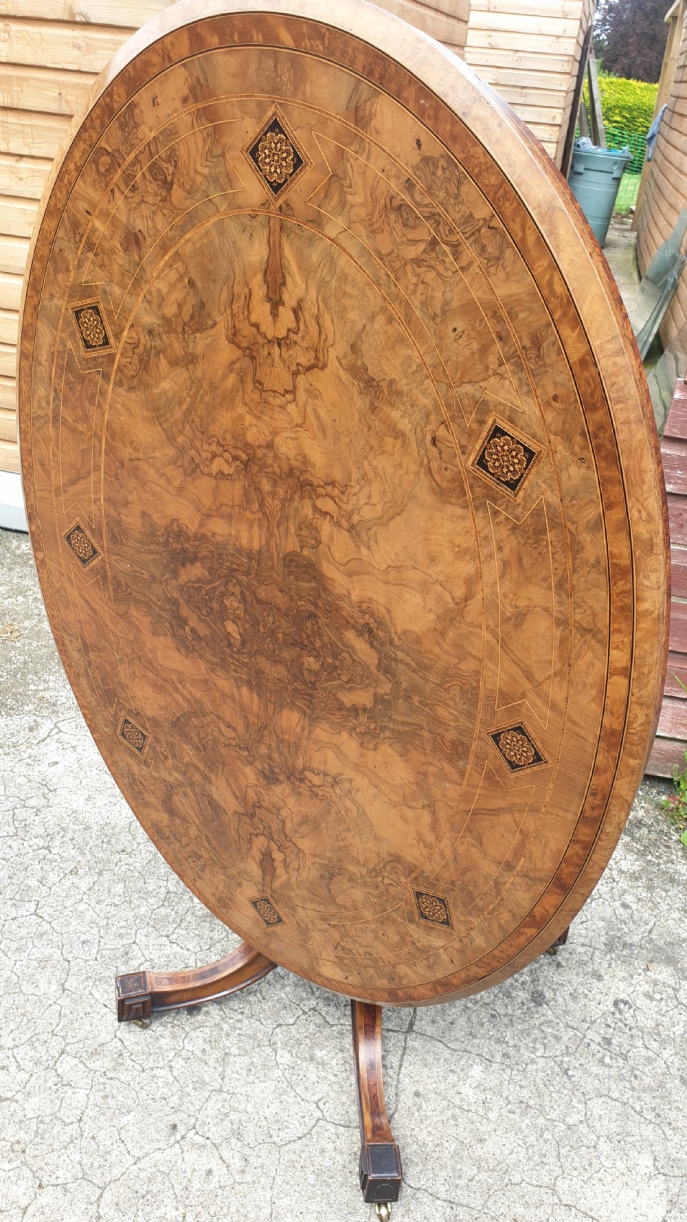 Victorian inlaid walnut oval tip top pedestal table.  View VII