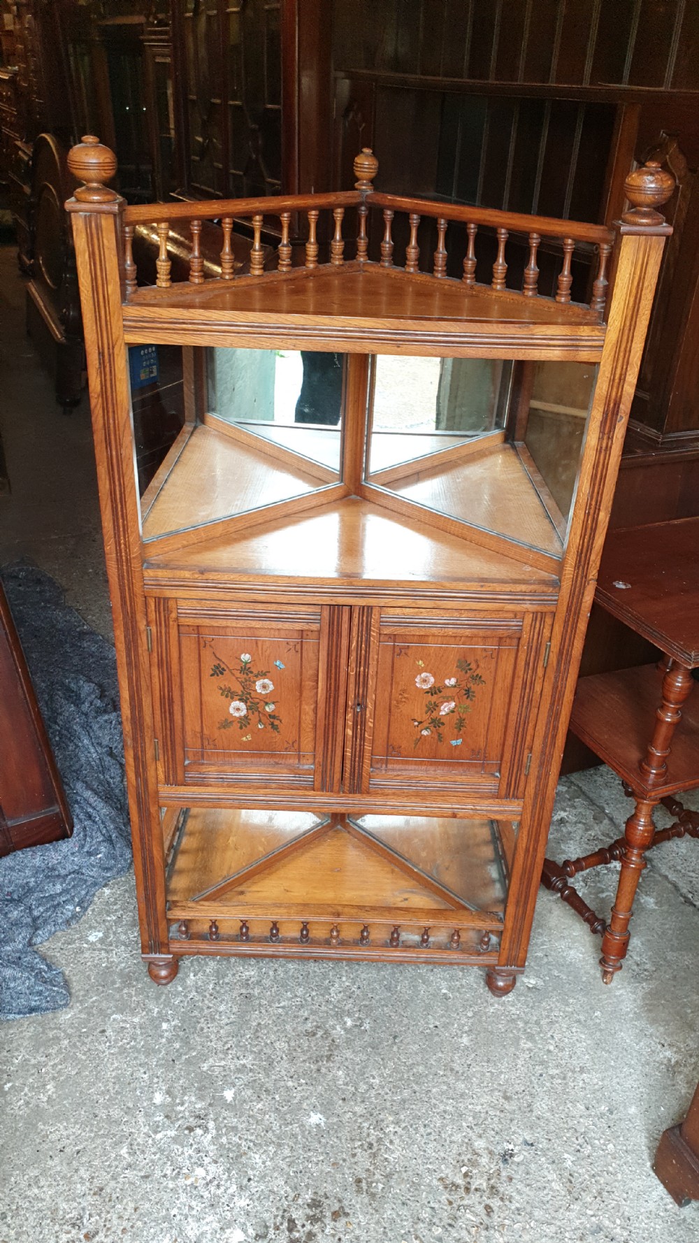 Victorian golden oak decorated corner cabinet. 