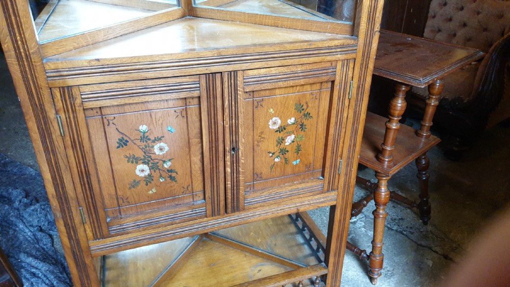 Victorian golden oak decorated corner cabinet.  View IV