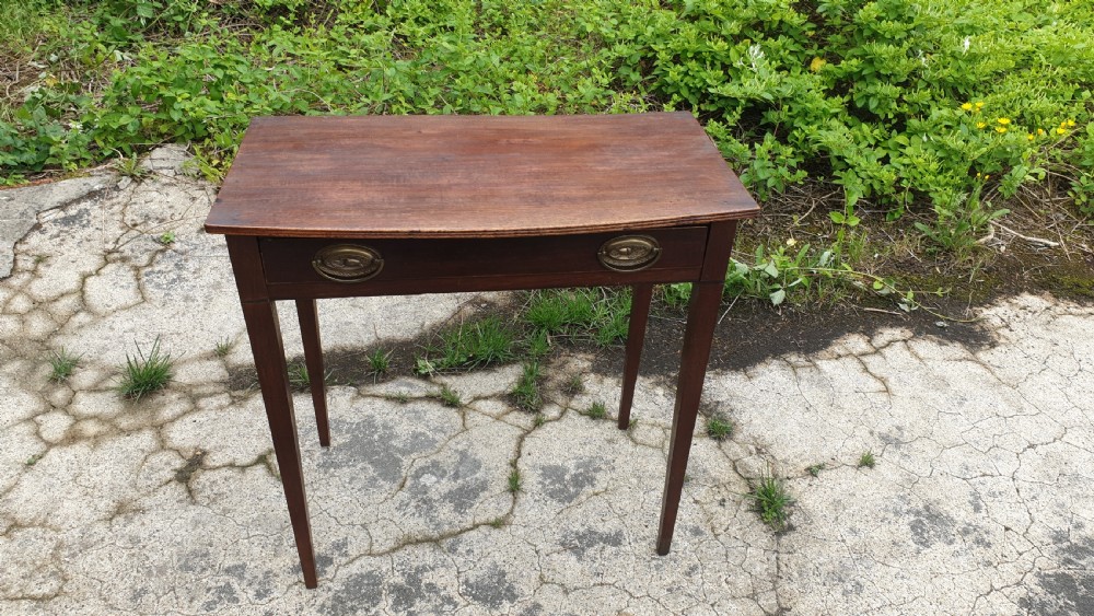 Early 19th century mahogany bow front side table. 