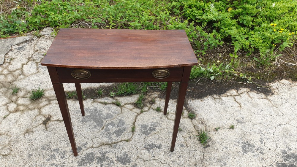 Early 19th century mahogany bow front side table.  View V