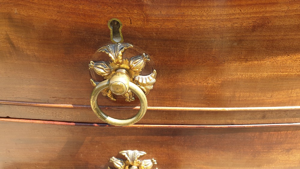 Regency mahogany bow front chest . View II