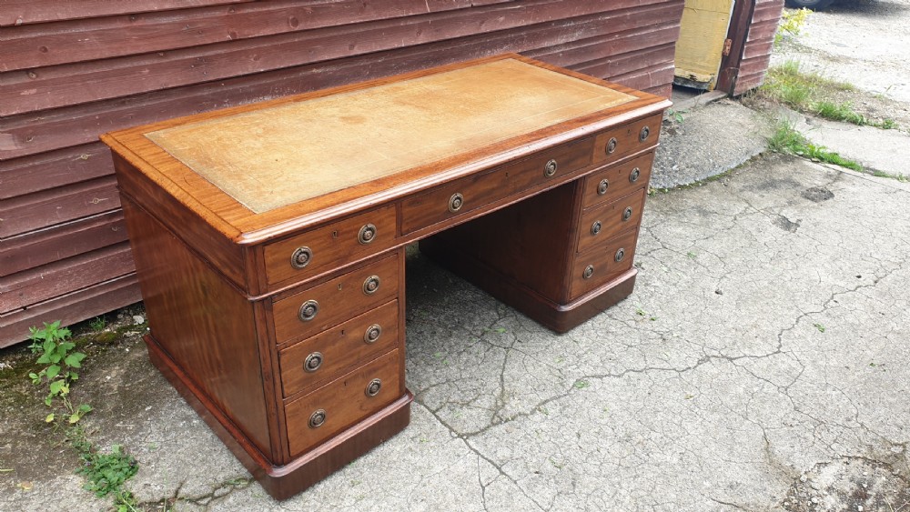 5 foot 19th century mahogany kneehole pedestal desk. 