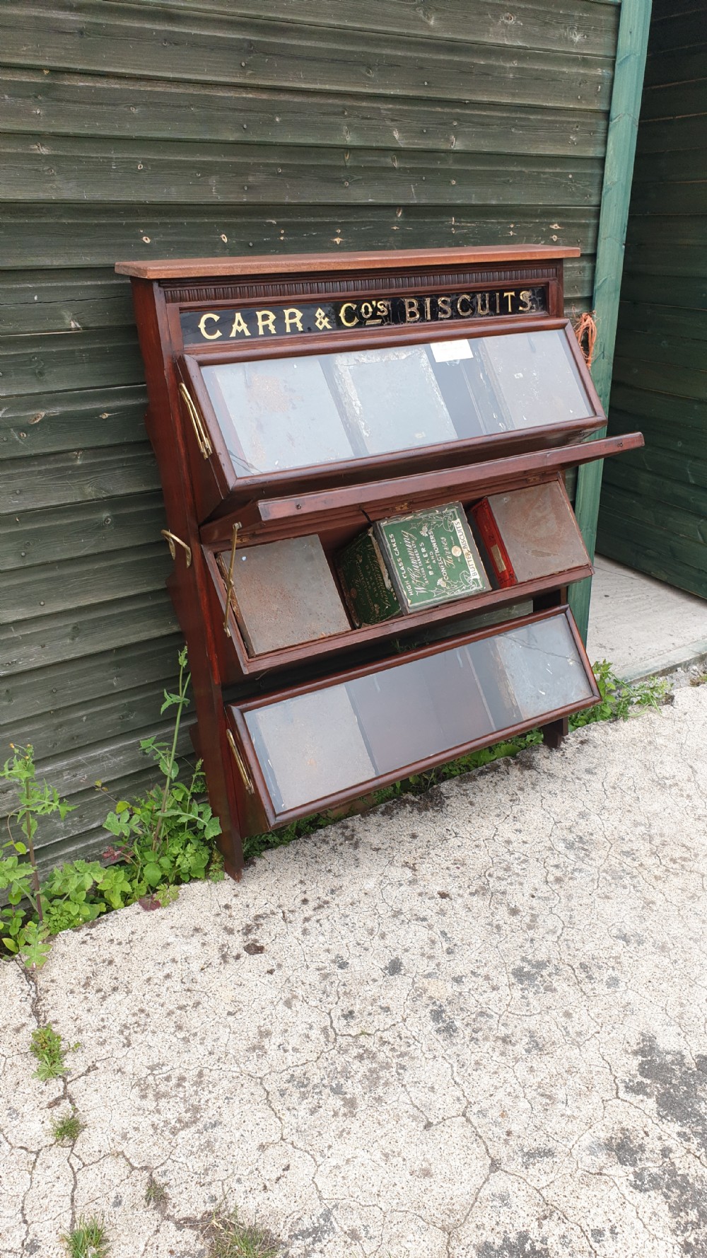 Late Victorian biscuit cabinet complete with biscuit tins.