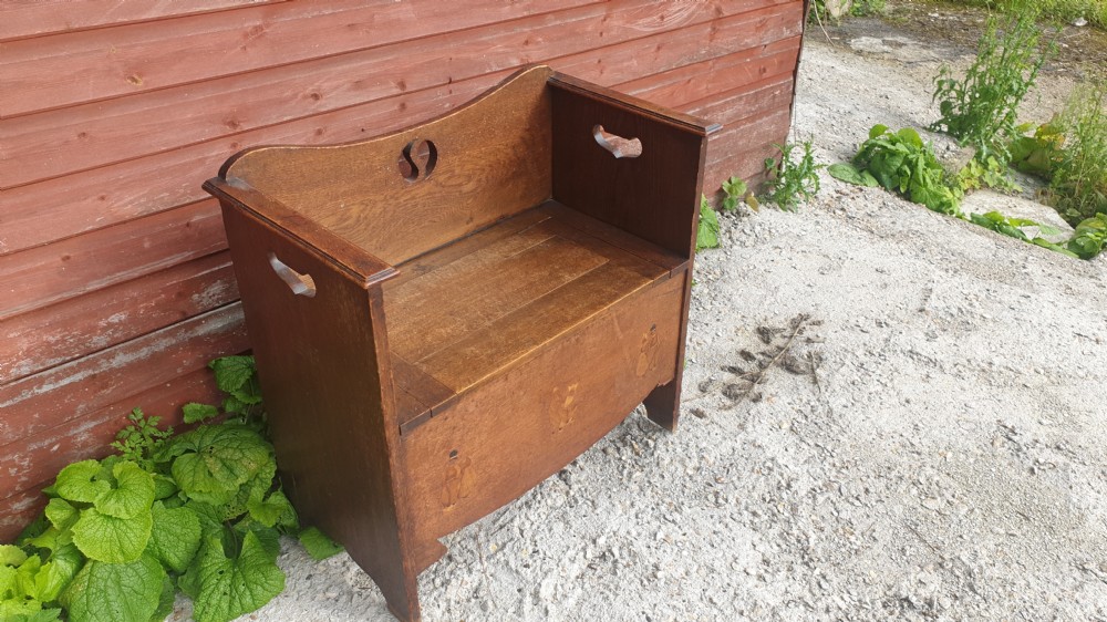 Inlaid oak hall seat in the manner of Liberty's.  View II