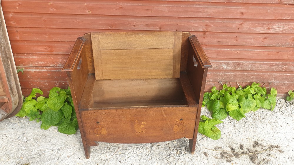 Inlaid oak hall seat in the manner of Liberty's.  View IV