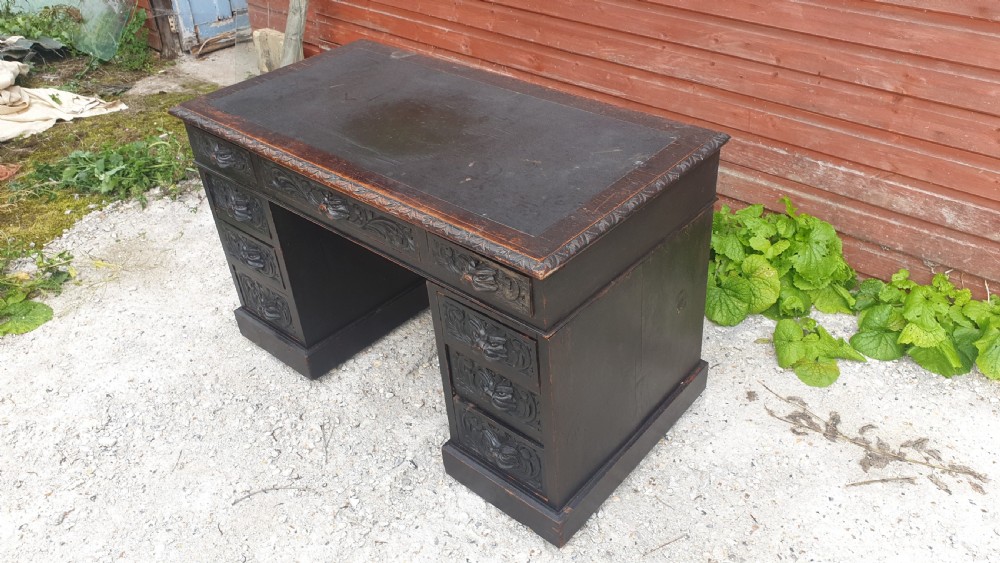 Late Victorian carved oak Green Man pedestal desk.  View II