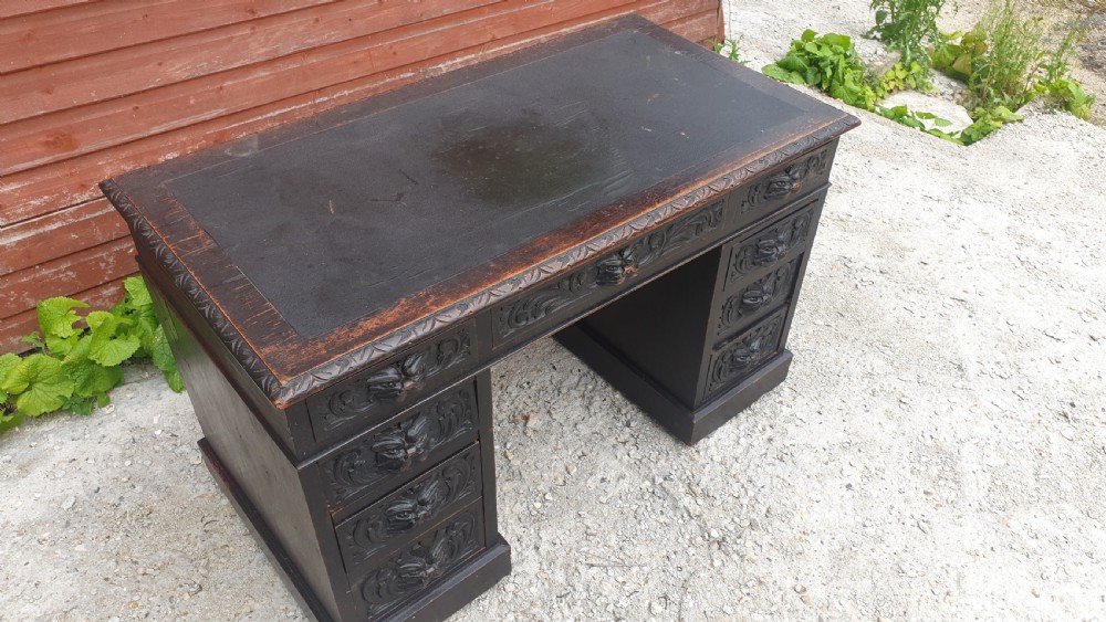 Late Victorian carved oak Green Man pedestal desk.  View III