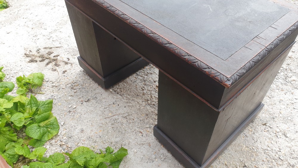 Late Victorian carved oak Green Man pedestal desk.  View V
