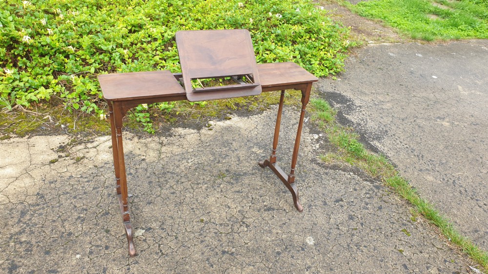 Edwardian mahogany reading table with adjustable slope. 