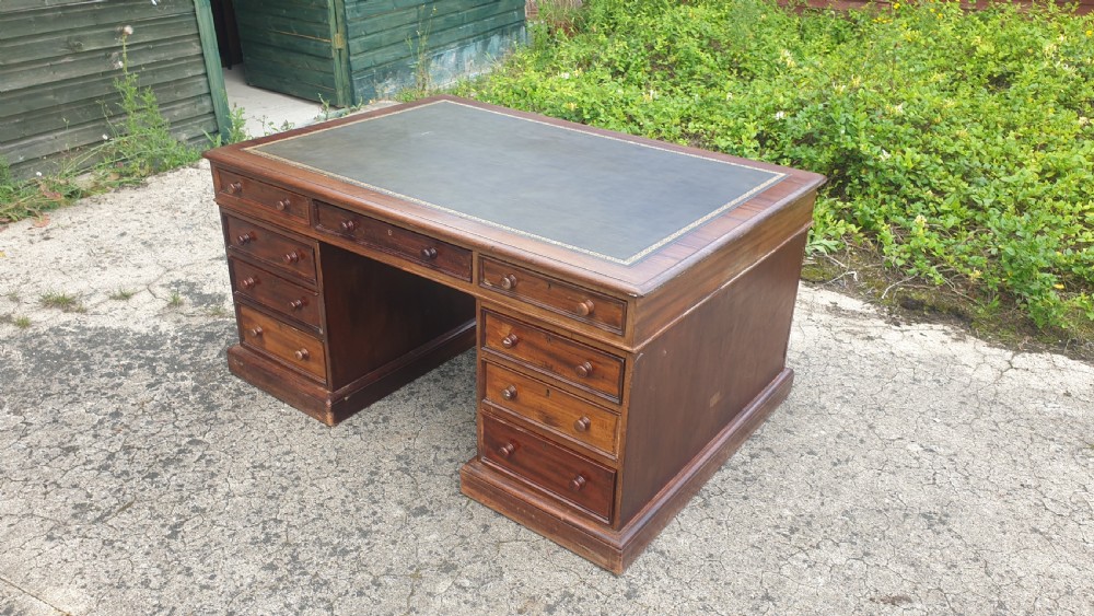 Victorian mahogany pedestal partners desk. Makers stamp.