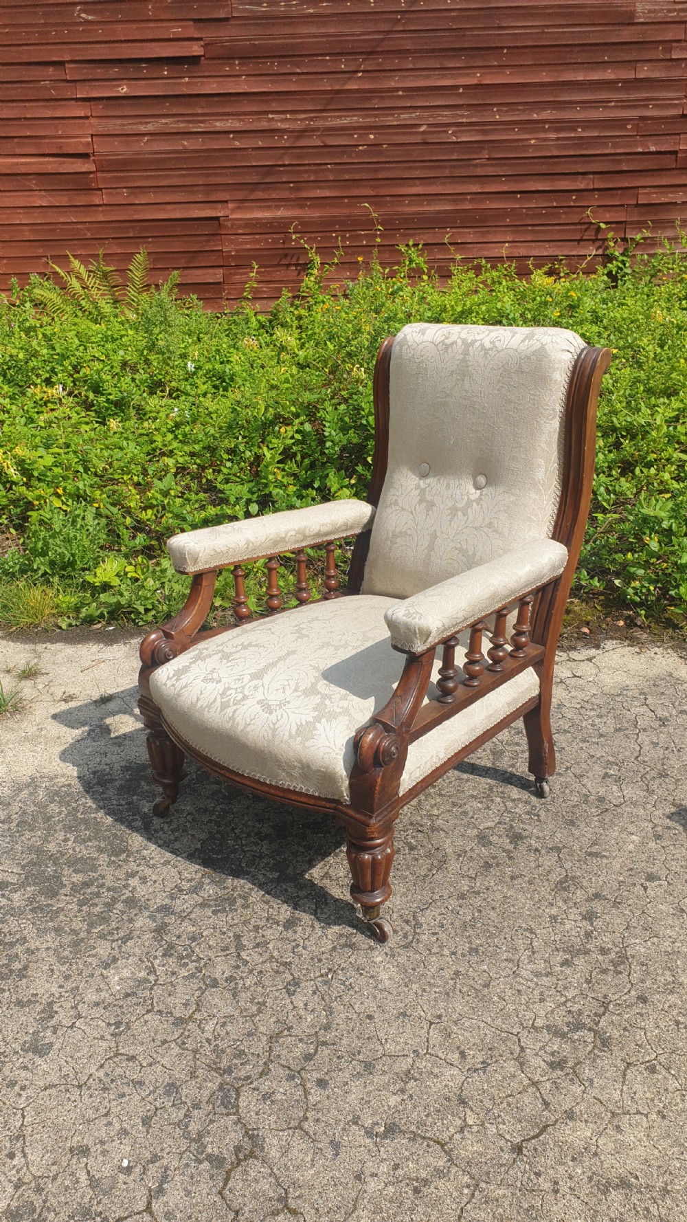 Victorian mahogany framed upholstered library armchair. 