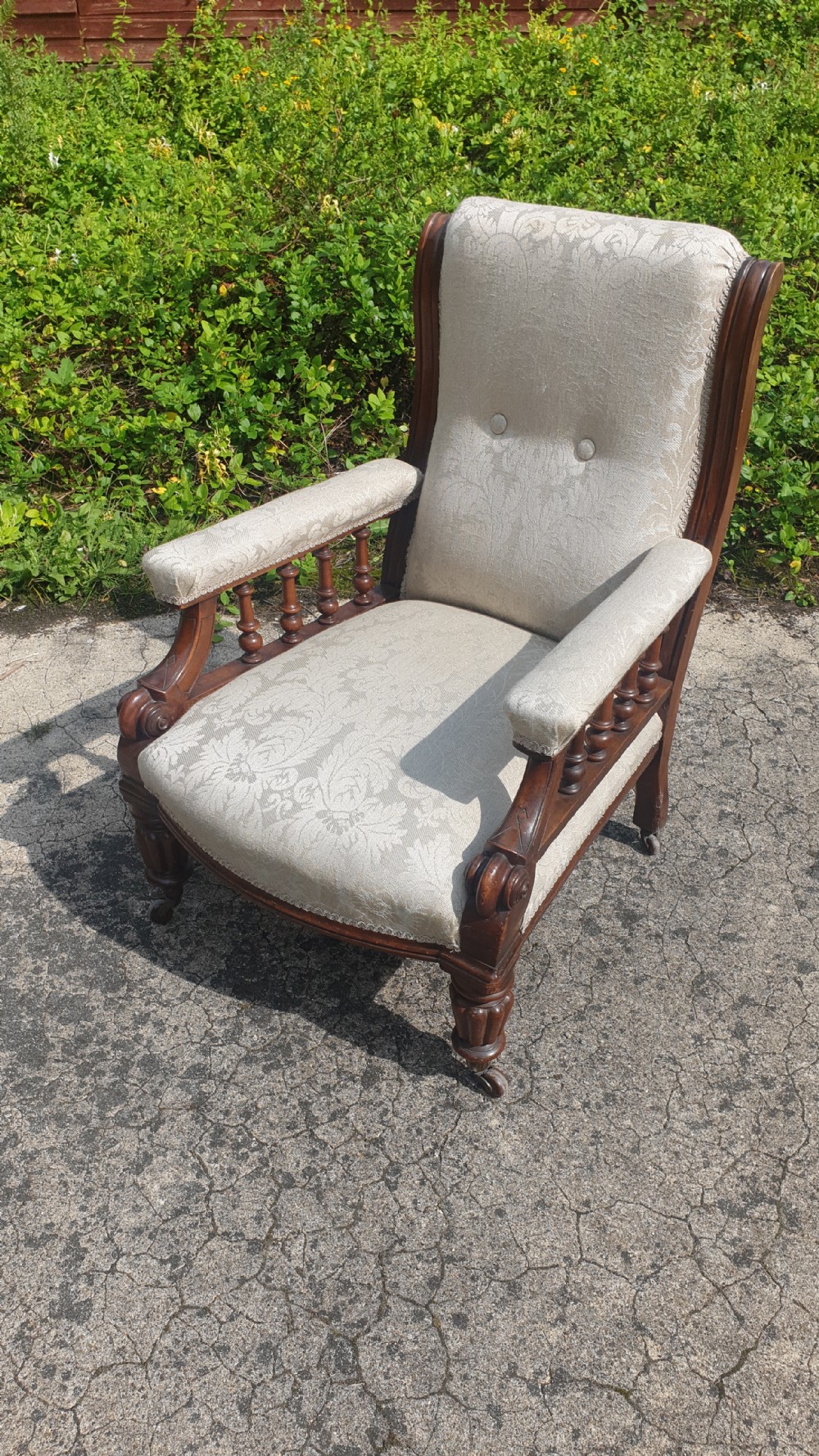 Victorian mahogany framed upholstered library armchair.  View II