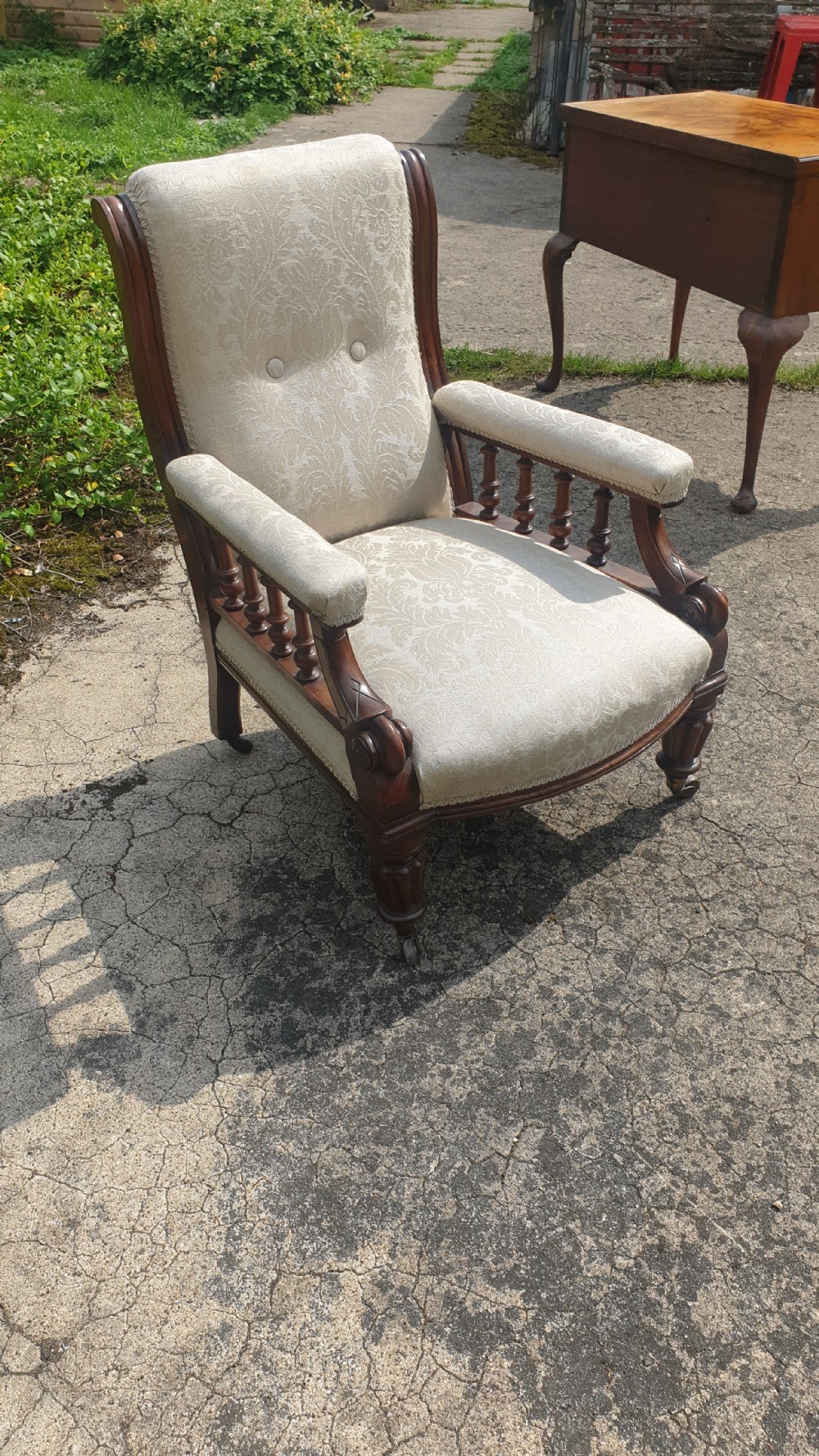 Victorian mahogany framed upholstered library armchair.  View IV