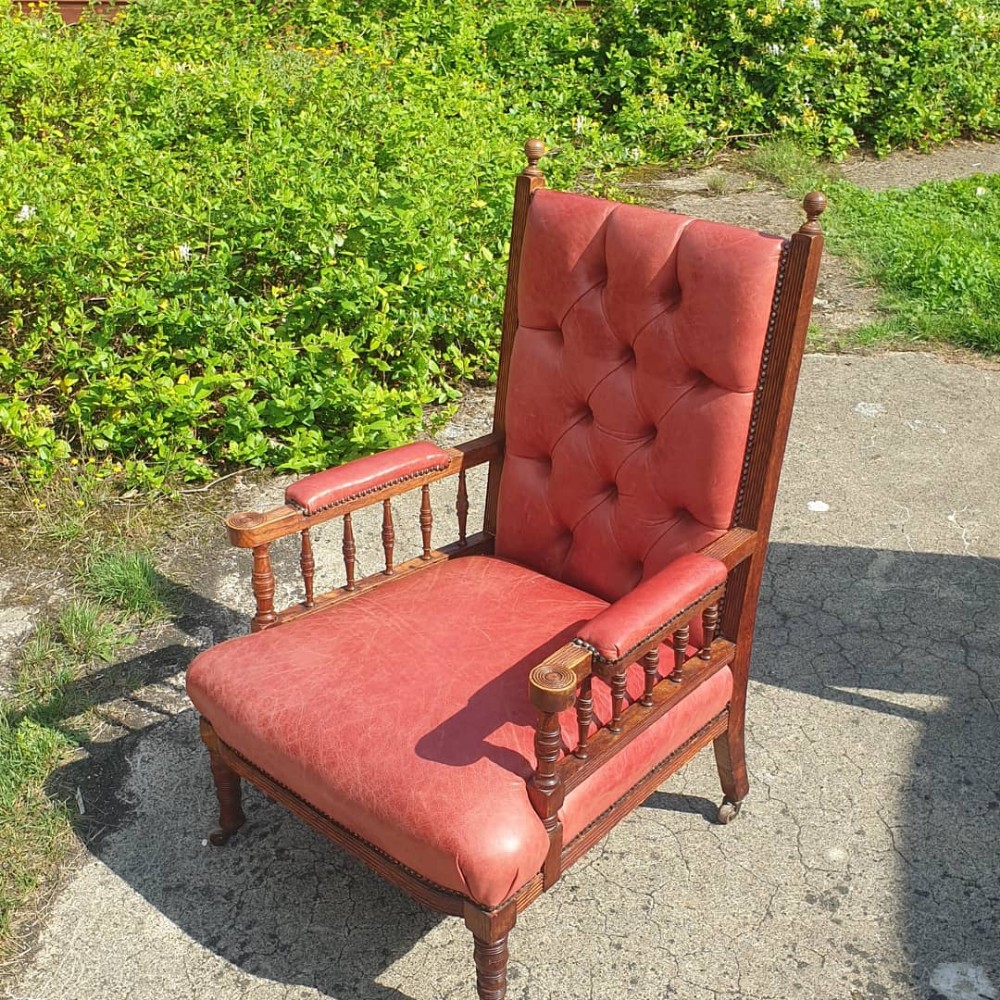 Late Victorian oak leather upholstered armchair. Stamped Gregory&Co.