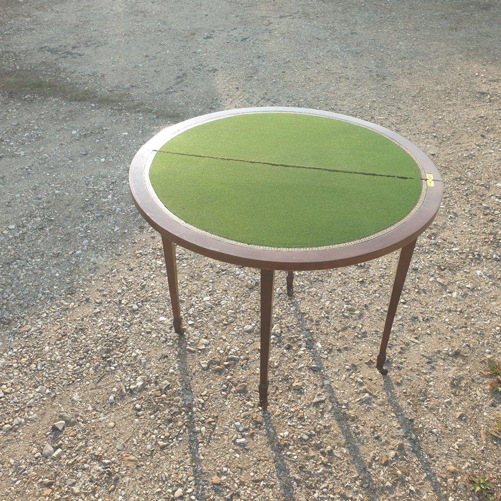 Edwardian inlaid mahogany games table. View II