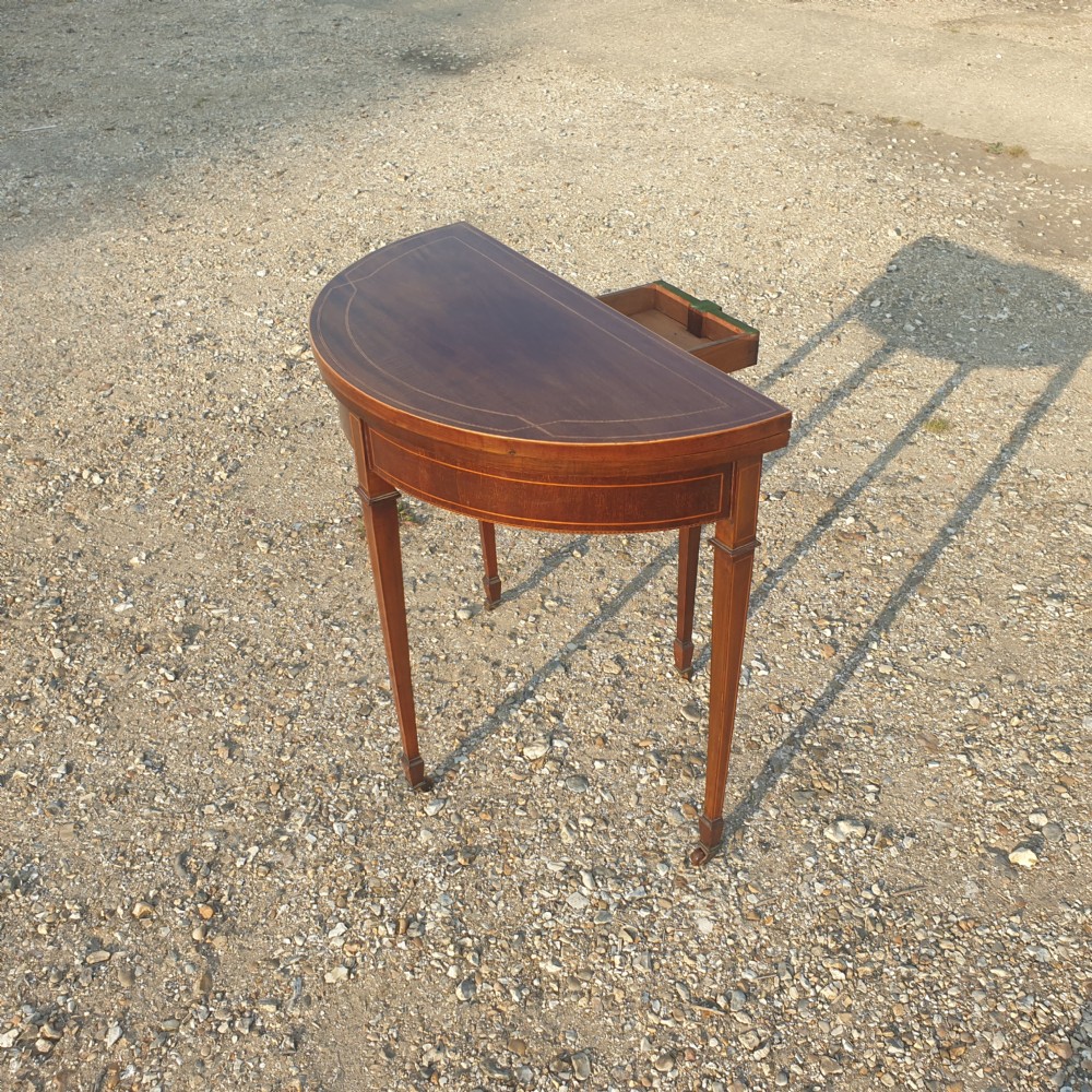 Edwardian inlaid mahogany games table. View IV