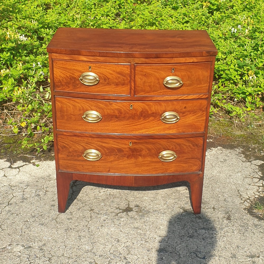 Small 19th century mahogany bow front chest. View III