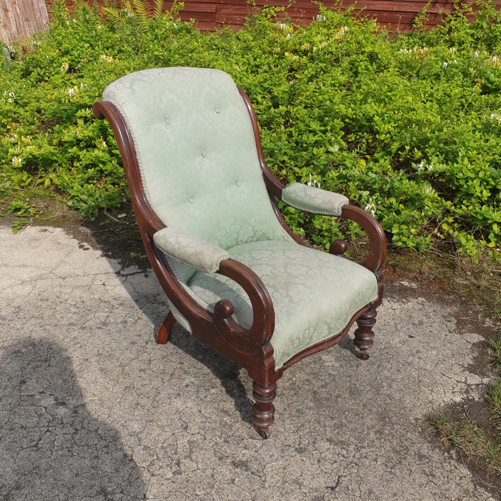 Early Victorian mahogany upholstered scroll arm armchair.  View II