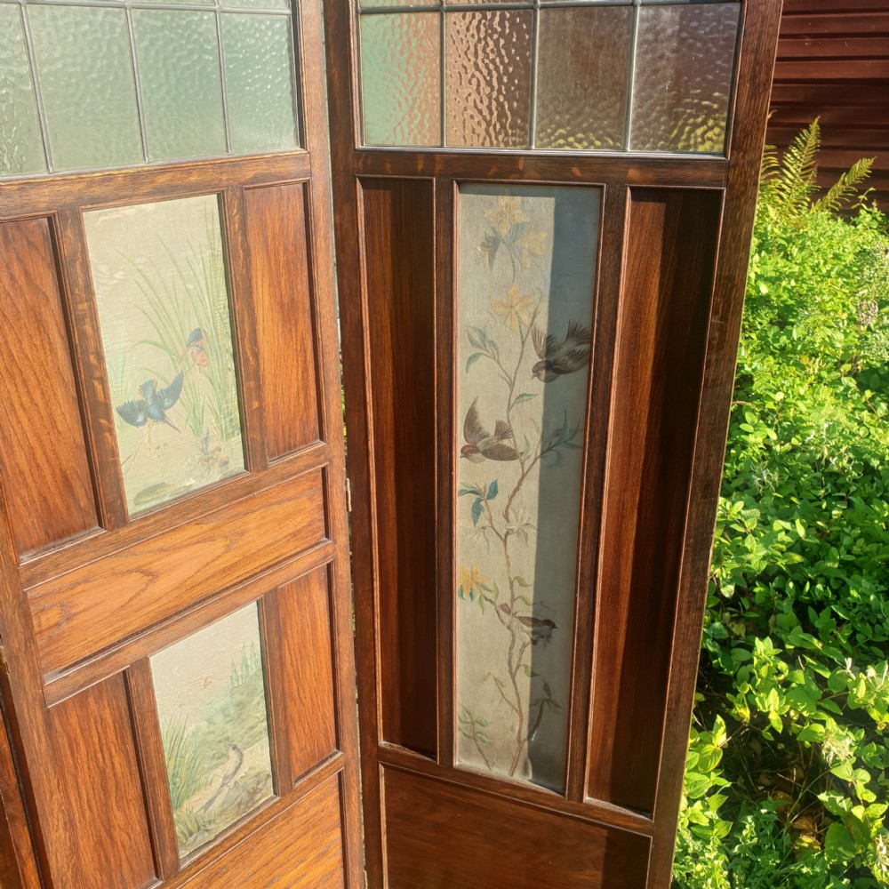 Edwardian panelled oak screen with painted decoration.  View II