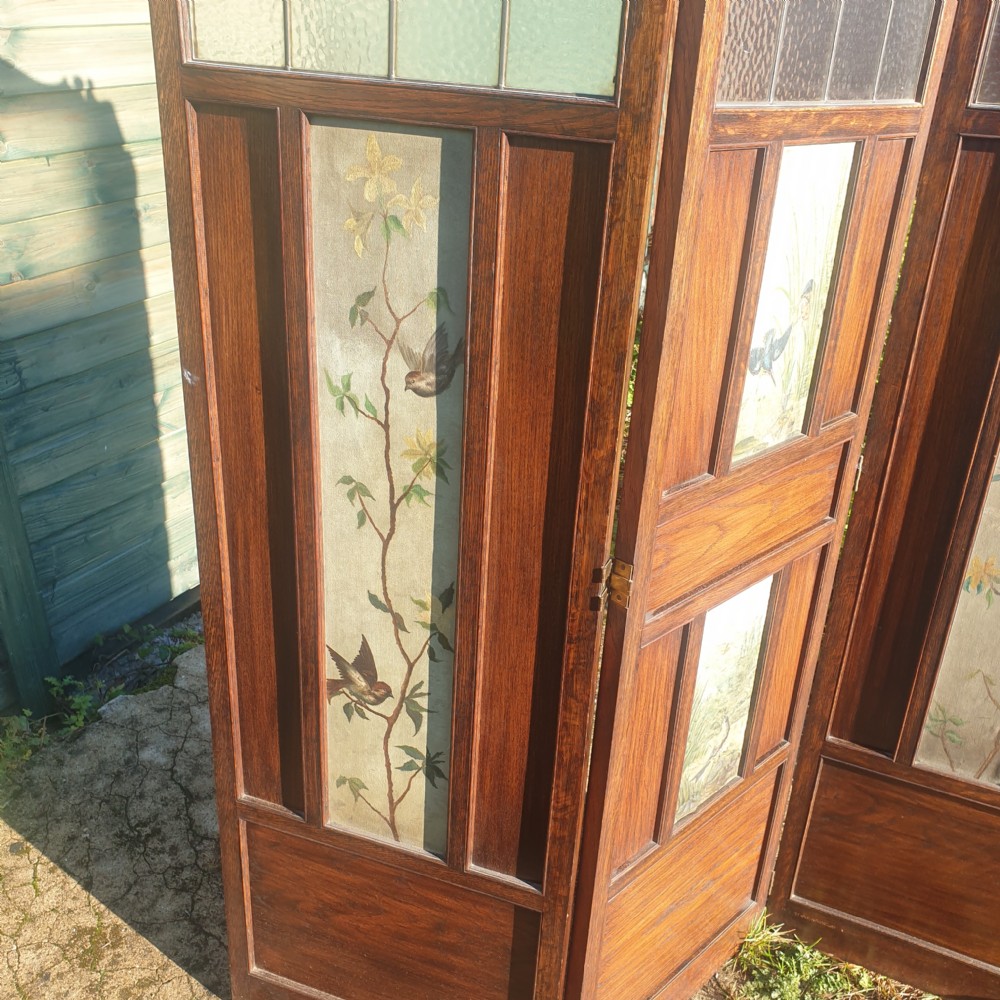 Edwardian panelled oak screen with painted decoration.  View IV
