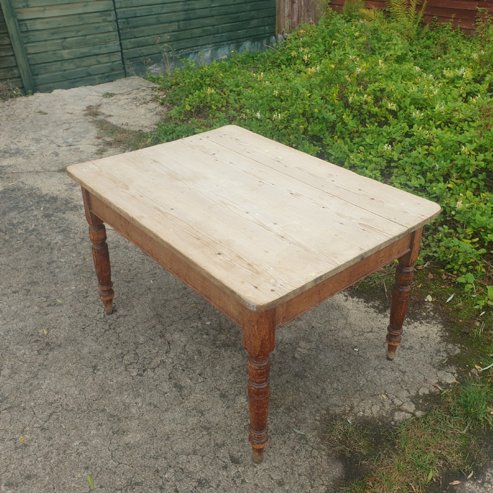 Late Victorian scrubbed top pine kitchen table.  View II