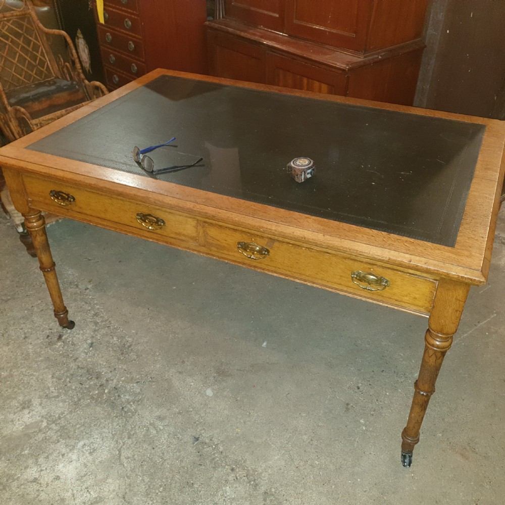Large late Victorian oak writing table  View II
